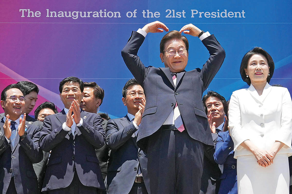 Lee making a heart at his June 4 Inauguration. copy