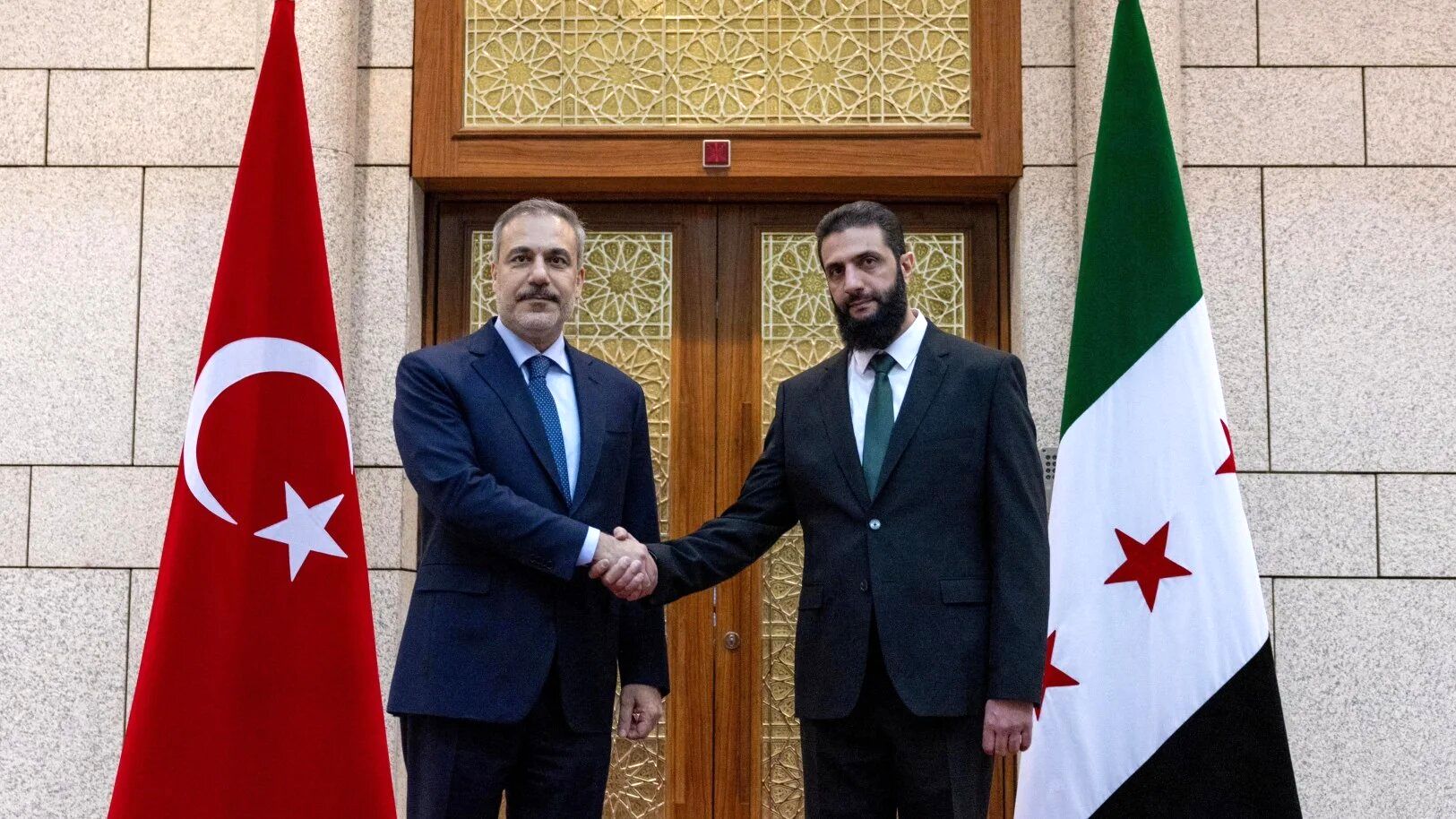 Turkey_s Foreign Minister Hakan Fidan meets with Syria_s de facto leader Ahmed al-Sharaa_ also known as Abu Mohammed al-Golani_ in Damascus_ Syria_ December 22_ 2024-reuters.jpg