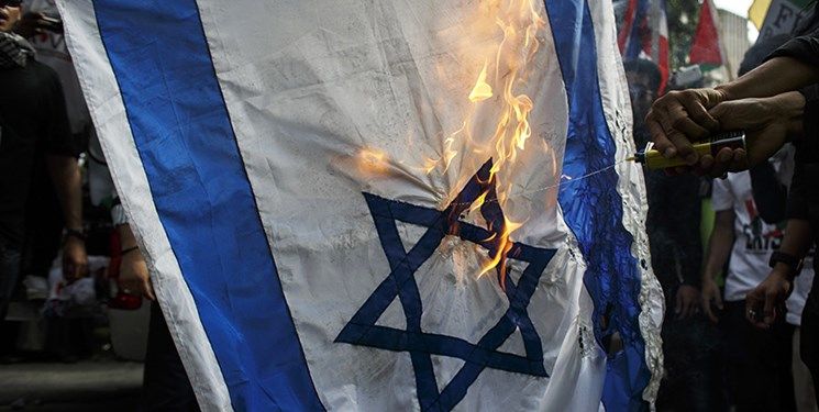 تظاهرات گسترده در استرالیا علیه جنایات اسرائیل / پرچم این رژیم به آتش کشیده شد