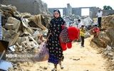 اینجا محله چاه تنگو قشم؛ بعد از حمله آمریکا/زنانی که در میان آوار جستجو می کنند+ عکس